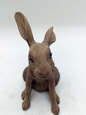 Lot 97 - A group of four pottery hares