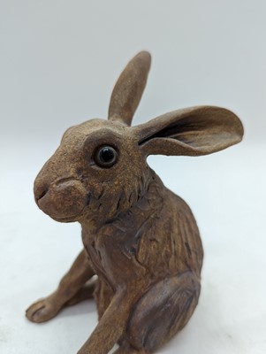 Lot 97 - A group of four pottery hares