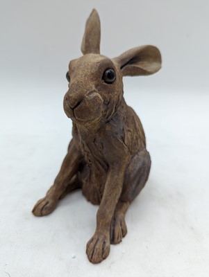 Lot 97 - A group of four pottery hares