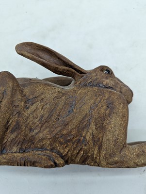 Lot 97 - A group of four pottery hares