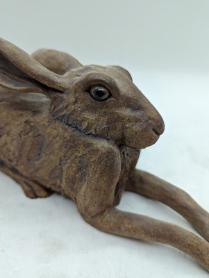 Lot 97 - A group of four pottery hares