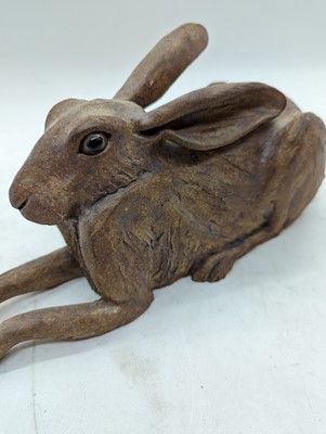 Lot 97 - A group of four pottery hares