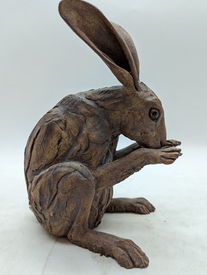 Lot 97 - A group of four pottery hares