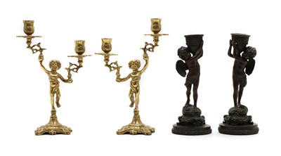 Lot 187 - A pair of brass figural candlesticks