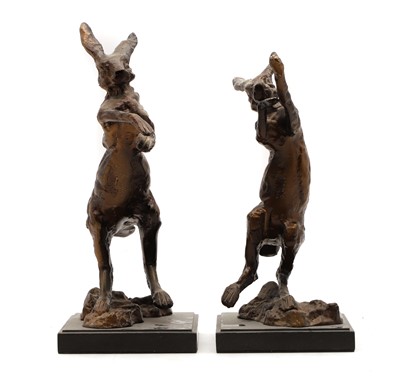 Lot 176 - A pair of bronze fighting hares