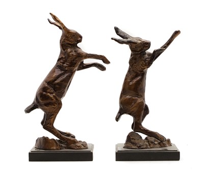 Lot 176 - A pair of bronze fighting hares