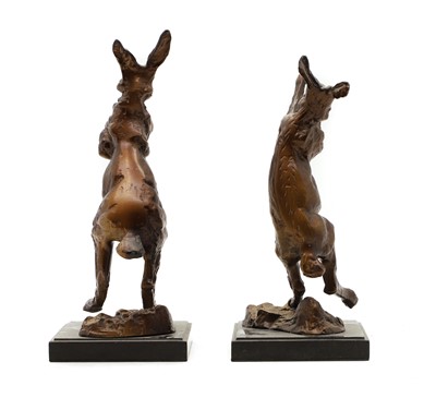 Lot 176 - A pair of bronze fighting hares