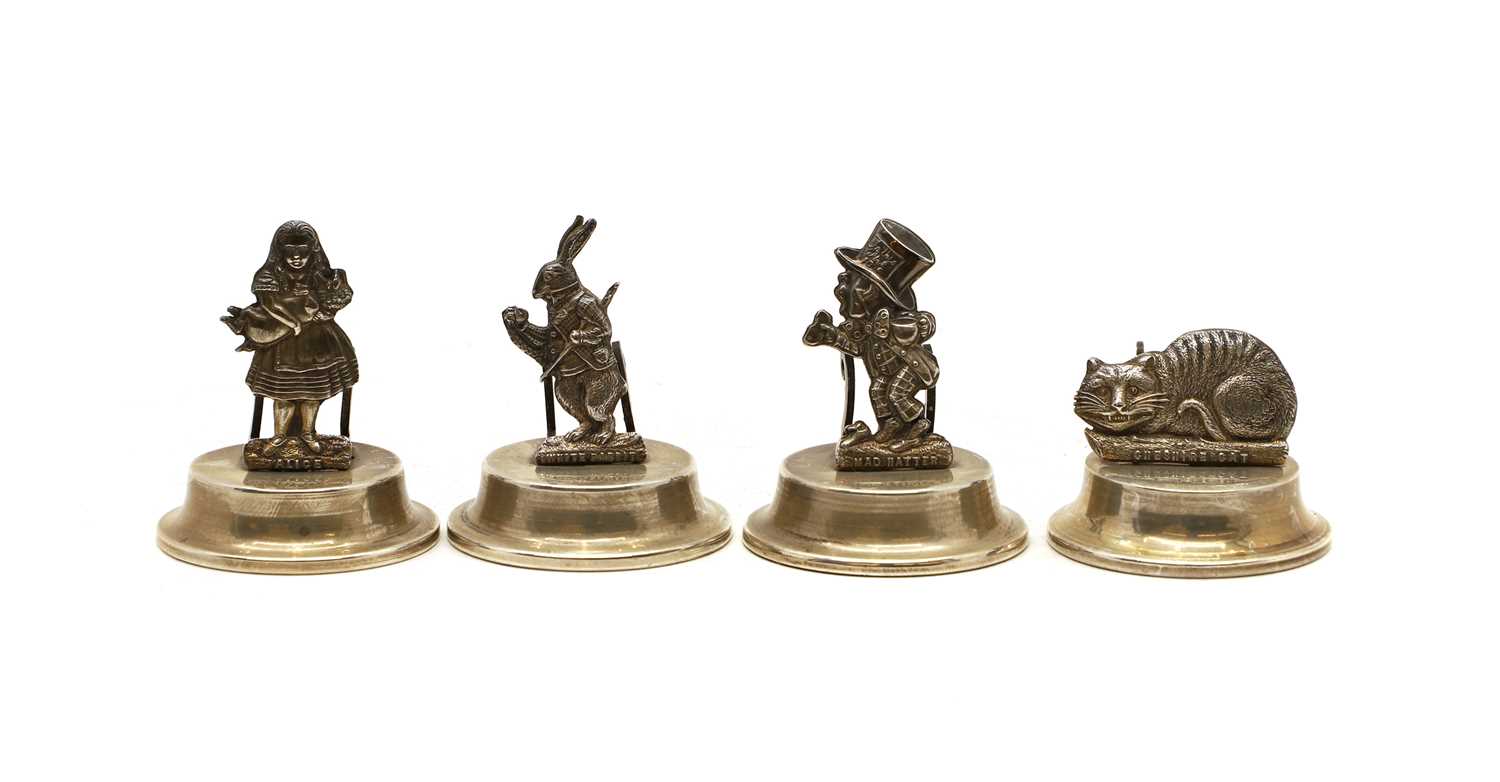 Lot 8 - A set of four silver novelty menu holders