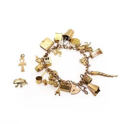 Lot 335 - A gold charm bracelet