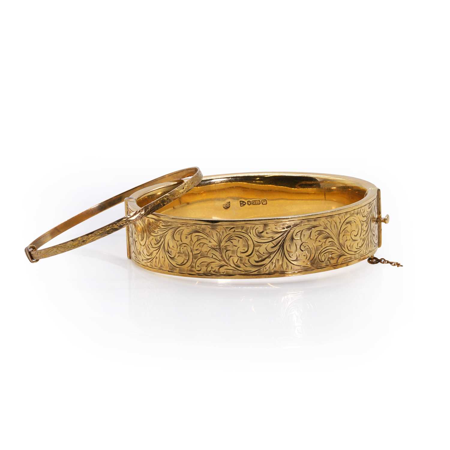 Lot 328 - Two 9ct gold bangles,