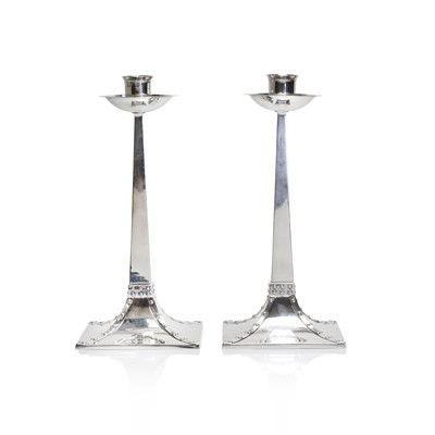 Lot 8 - A pair of Arts and Crafts silver candlesticks