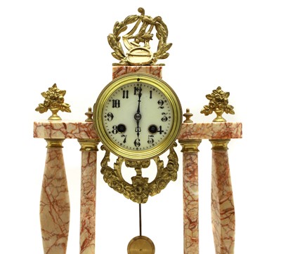 Lot 169 - An Empire style hardstone clock