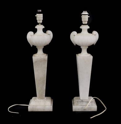 Lot 334 - A pair of alabaster lamps