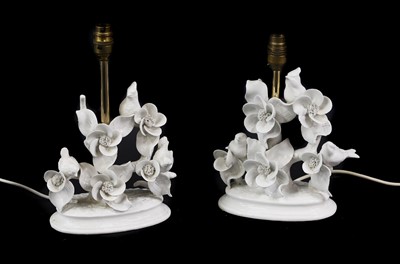 Lot 335 - A pair of Blanc de Chine style porcelain table lamps