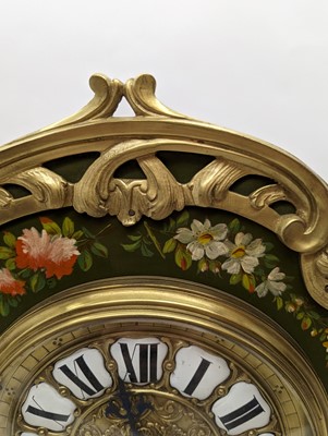 Lot 164 - A Louis XV style painted wood mantel clock