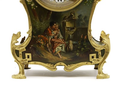 Lot 164 - A Louis XV style painted wood mantel clock