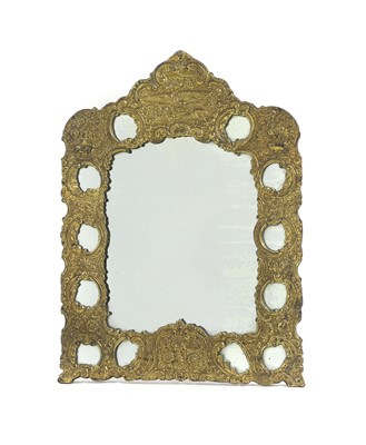 Lot 331 - A gilt repoussé metal mirror