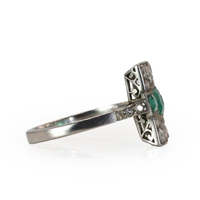Lot 60 - An emerald and diamond panel ring, c.1915
