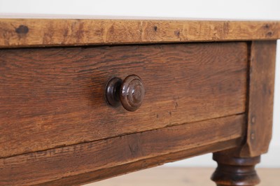 Lot 64 - A Victorian oak kitchen table