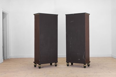Lot 18 - A pair of painted and parcel-gilt wooden cupboards