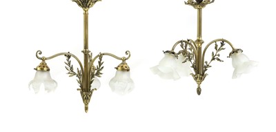 Lot 336 - A Edwardian three light brass and frosted glass chandelier