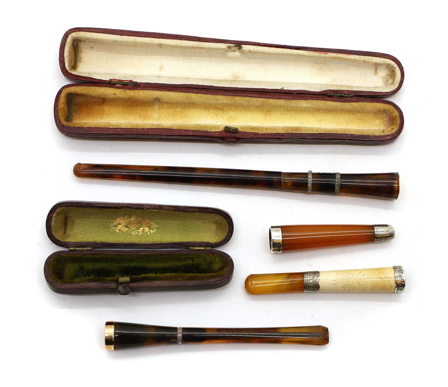 Lot 53 - Two tortoiseshell and diamond inlaid cigarette holders