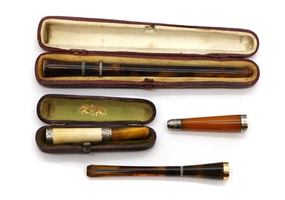 Lot 53 - Two tortoiseshell and diamond inlaid cigarette holders