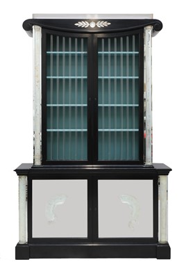 Lot 374 - An Art Deco Hollywood Regency ebonised bookcase