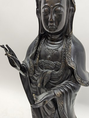 Lot 68 - A Chinese bronze figure of Guanyin