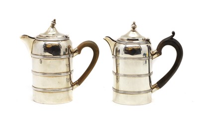 Lot 1 - Two silver hot water jugs