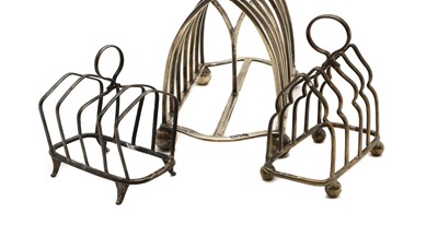 Lot 9 - A group of three silver toast racks