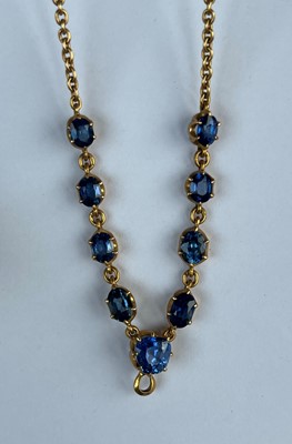 Lot 11 - A late Victorian sapphire necklace and a matched pair of sapphire and diamond drop earrings
