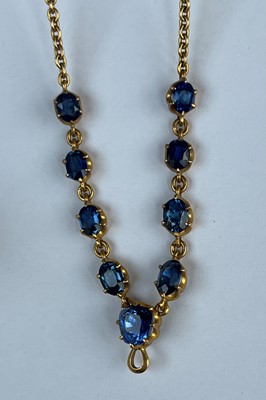 Lot 11 - A late Victorian sapphire necklace and a matched pair of sapphire and diamond drop earrings