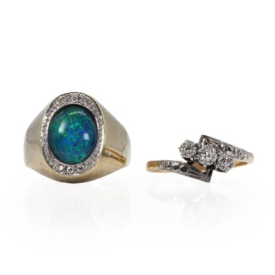 Lot 210 - A gold diamond crossover ring and an opal triplet ring