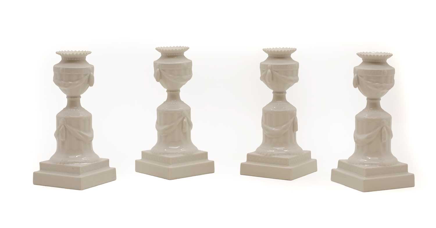 Lot 99 - A set of four Royal Copenhagen porcelain candlesticks