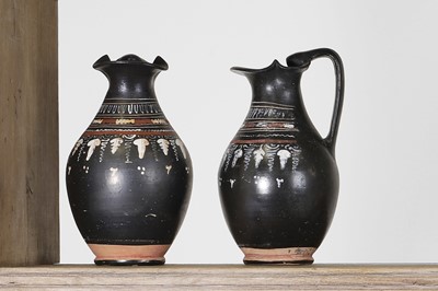 Lot 89 - A near pair of Apulian Gnathian ware pottery oinochoai