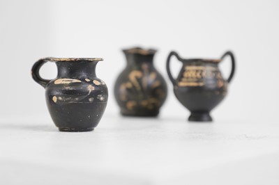 Lot 102 - A group of six Xenon ware miniature pottery vessels