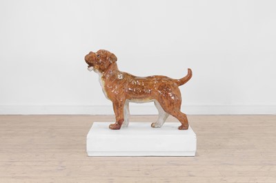 Lot 407 - A glazed pottery boxer dog