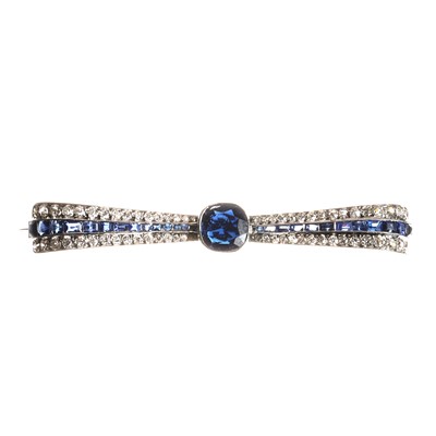 Lot 66 - A diamond and sapphire bow brooch, c.1920