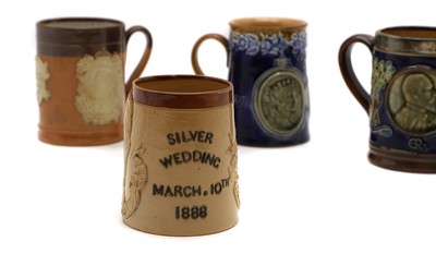 Lot 144 - A group of four commemorative stoneware commemorative mugs