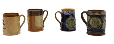 Lot 144 - A group of four commemorative stoneware commemorative mugs