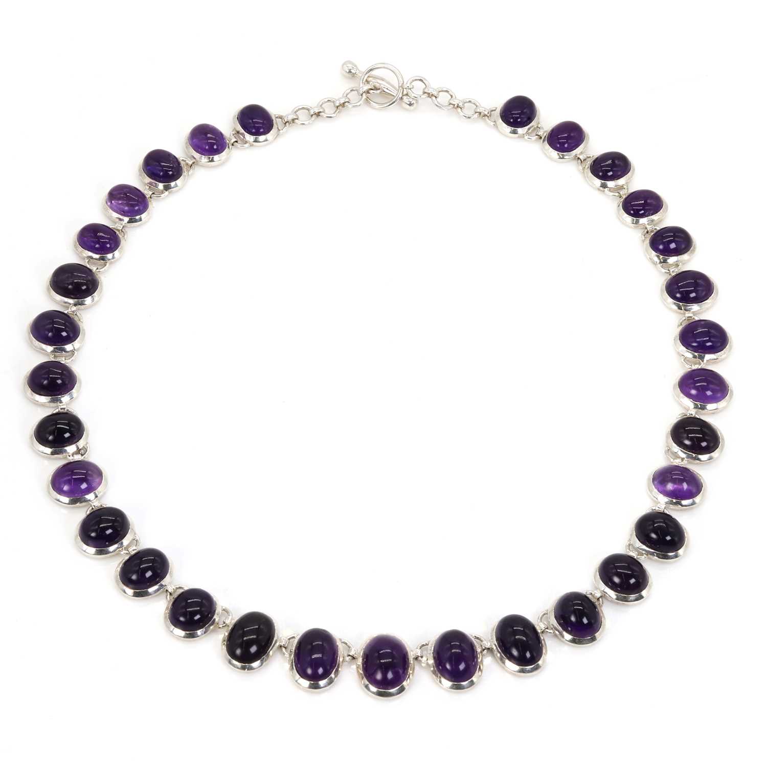 Lot 127 - A silver graduated amethyst necklace