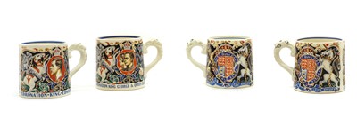 Lot 138 - A group of four commemorative pottery mugs