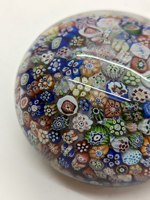 Lot 279 - A Baccarat close-packed millefiori glass paperweight