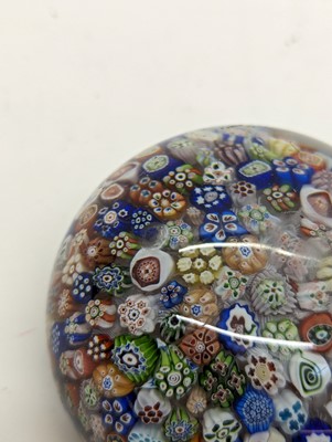 Lot 279 - A Baccarat close-packed millefiori glass paperweight