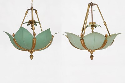 Lot 642 - A set of three patinated-metal ceiling lights