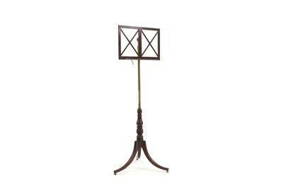 Lot 566 - A George III mahogany and brass music stand