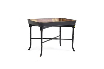 Lot 472 - A Regency-style ebonised and parcel-gilt tray table