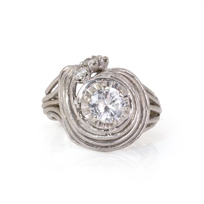 Lot 117 - A white gold diamond wirework swirl design ring