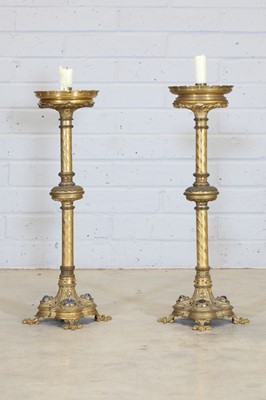 Lot 357 - A pair of brass candlesticks